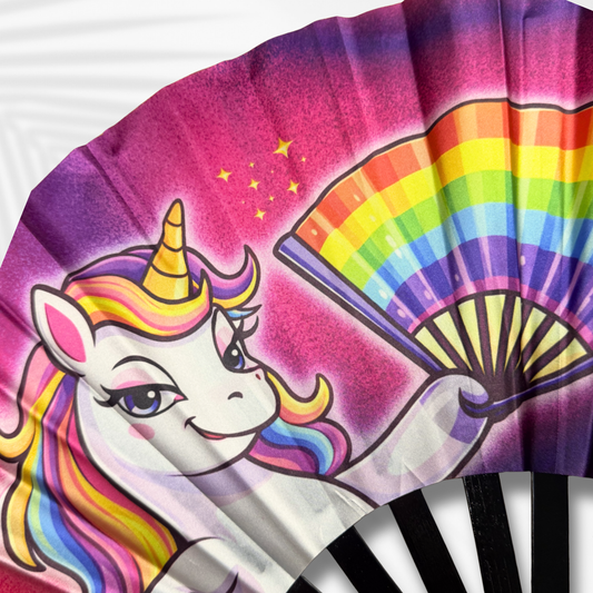 Colorful hand fan with a unicorn design holding a rainbow, on a white background.