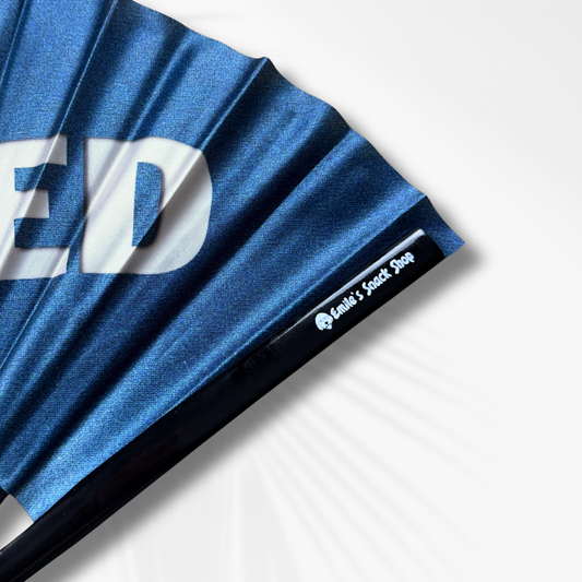Close up of Blue Fabric Clack Fan with logo