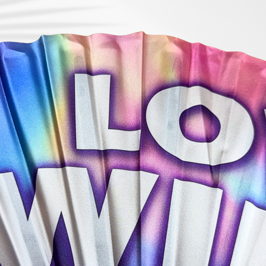 Colorful fabric with 'LOVE WINS' printed on it