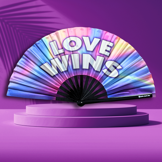 Colorful hand clack fan with 'LOVE WINS' text on a purple background